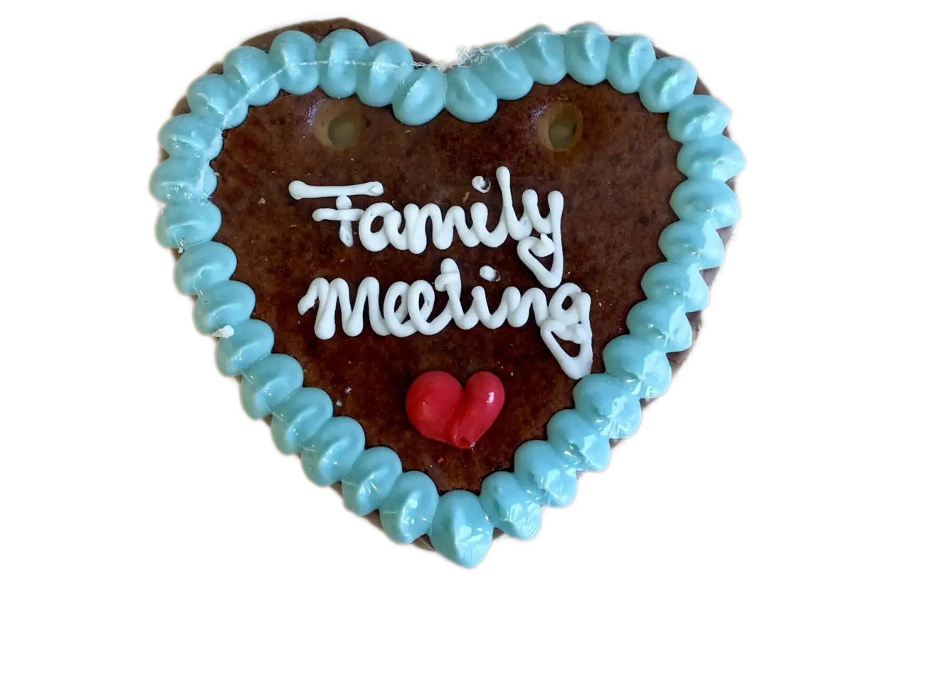 Lebkuchenherz mit Aufschrift Family Meeting